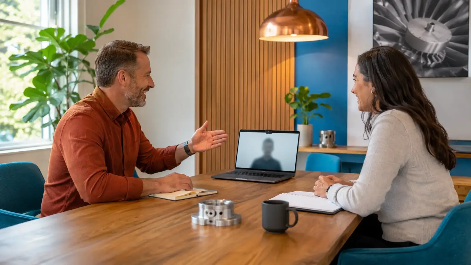 Technical marketing advisor and engineering-company owner having a relaxed hybrid consultation.